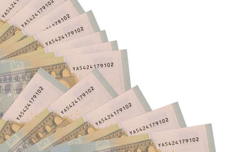 5 euro bills lies isolated on white background with copy space stacked in fan close up. Payday time concept or financial operationsの写真素材