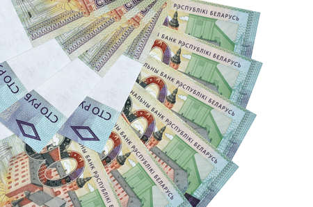 100 Belorussian rubles bills lies isolated on white background with copy space stacked in fan shape...