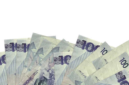 100 Philippine piso bills lies on bottom side of screen isolated on white background with copy space. Background banner template for business concepts with moneyの写真素材