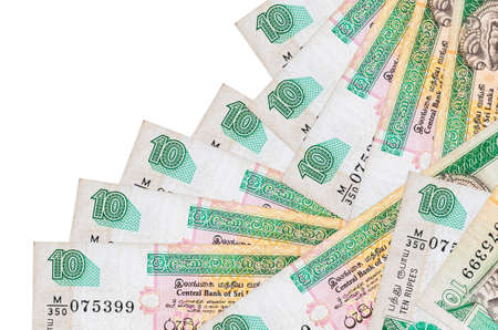 10 Sri Lankan rupees bills lies in different order isolated on white. Local banking or money making...