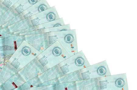 2 Colombian pesos bills lies isolated on white background with copy space stacked in fan close up....