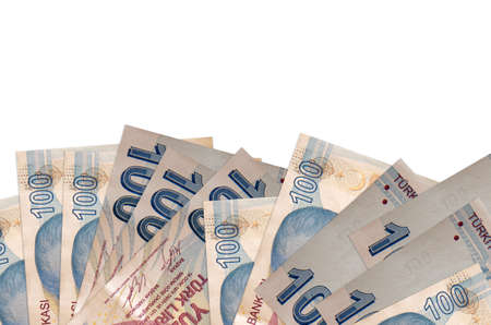 100 Turkish liras bills lies on bottom side of screen isolated on white background with copy space....