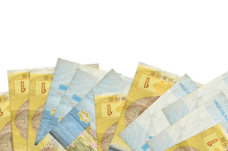 1 Ukrainian hryvnia bills lies on bottom side of screen isolated on white background with copy space. Background banner template for business concepts with moneyの写真素材