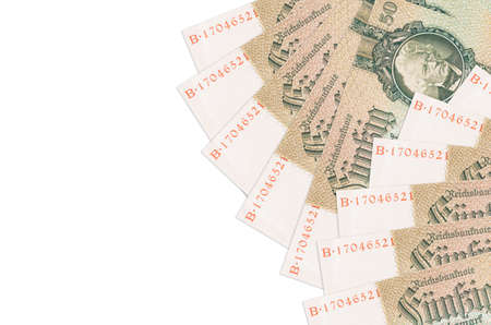 50 Reich marks bills lies isolated on white background with copy space. Rich life conceptual background. Big amount of national currency wealthの写真素材