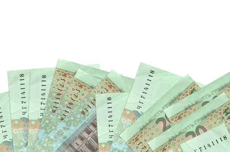 20 Ukrainian hryvnias bills lies on bottom side of screen isolated on white background with copy...