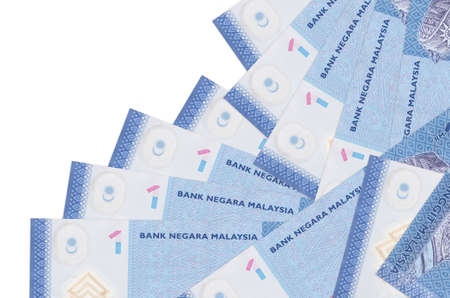 1 Malaysian ringgit bills lies in different order isolated on white. Local banking or money making...
