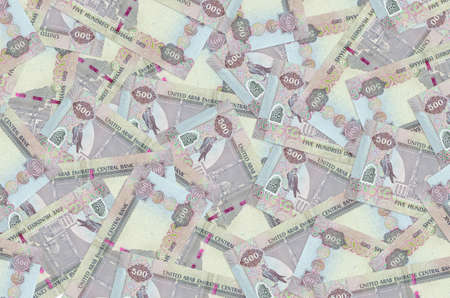 500 UAE dirhams bills lies in big pile. Rich life conceptual background. Big amount of money