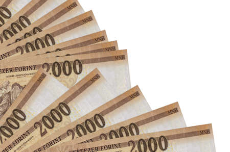 2000 Hungarian forint bills lies isolated on white background with copy space stacked in fan close up. Payday time concept or financial operationsの写真素材