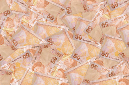 50 Turkish liras bills lies in big pile. Rich life conceptual background. Big amount of money