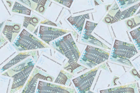 10 Croatian kuna bills lies in big pile. Rich life conceptual background. Big amount of money