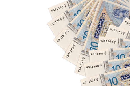 10 Tunisian dinars bills lies isolated on white background with copy space. Rich life conceptual background. Big amount of national currency wealthの写真素材