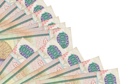 1000 Sri Lankan rupees bills lies isolated on white background with copy space stacked in fan close...