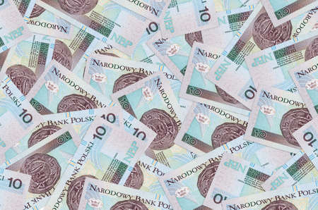 10 Polish zloty bills lies in big pile. Rich life conceptual background. Big amount of money