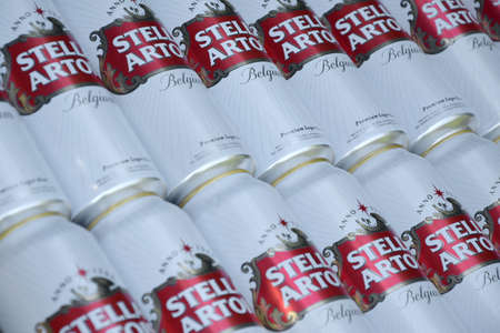 KHARKOV, UKRAINE - AUGUST 22 2020: Many tin cans of Stella Artois beer outdoors. Stella Artois is the most famous Belgian beer in the world owned by AB InBevのeditorial素材