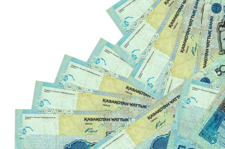 500 Kazakhstani tenge bills lies in different order isolated on white. Local banking or money making...