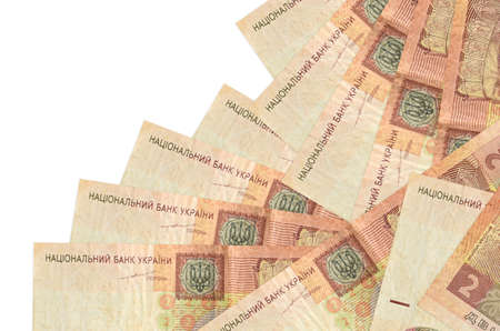2 Ukrainian hryvnias bills lies in different order isolated on white. Local banking or money making...