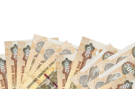 200 UAE dirhams bills lies on bottom side of screen isolated on white background with copy space....