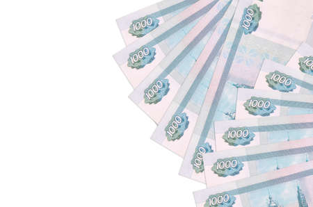 1000 russian rubles bills lies isolated on white background with copy space. Rich life conceptual...