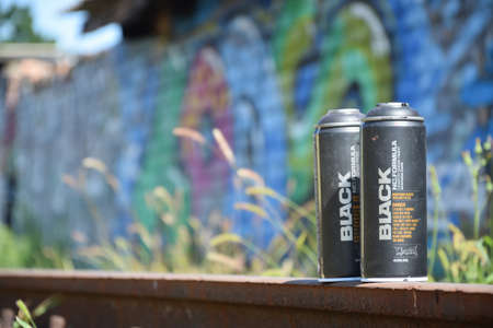 KHARKOV, UKRAINE - AUGUST 16, 2020: Used Montana black aerosol spray cans against graffiti...