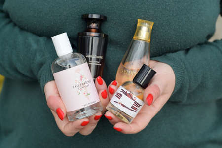 KHARKOV, UKRAINE - OCTOBER 16 2020: Young girl holds Yves Rocher production in bottles. Yves Rocher is a worldwide cosmetics and beauty brand founded in 1959 in franceのeditorial素材