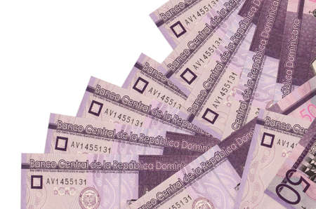 50 Dominican pesos bills lies in different order isolated on white. Local banking or money making concept. Business background bannerの写真素材
