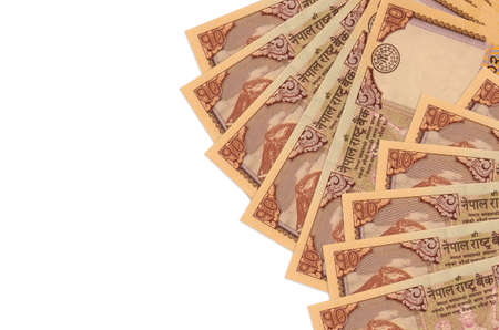 10 Nepalese rupees bills lies isolated on white background with copy space. Rich life conceptual background. Big amount of national currency wealthの写真素材