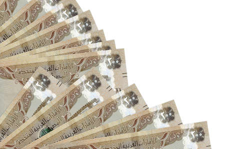 200 UAE dirhams bills lies isolated on white background with copy space stacked in fan close up....
