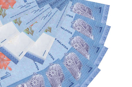1 Malaysian ringgit bills lies isolated on white background with copy space stacked in fan shape...