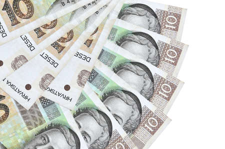 10 Croatian kuna bills lies isolated on white background with copy space stacked in fan shape close...