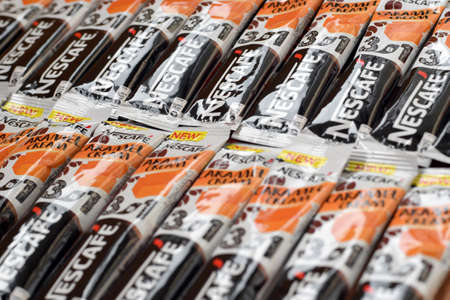 KHARKOV, UKRAINE - MARCH 21, 2020: Many Nescafe caramel cream coffee sticks. Nescafe is a brand of...