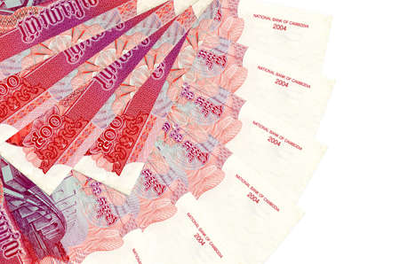 500 Cambodian riels bills lies isolated on white background with copy space stacked in fan shape...
