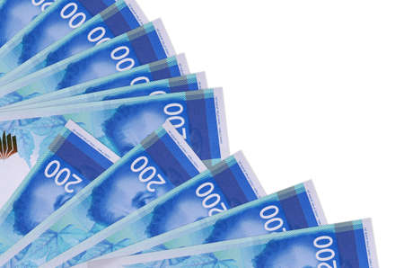 200 Israeli new shekels bills lies isolated on white background with copy space stacked in fan close...