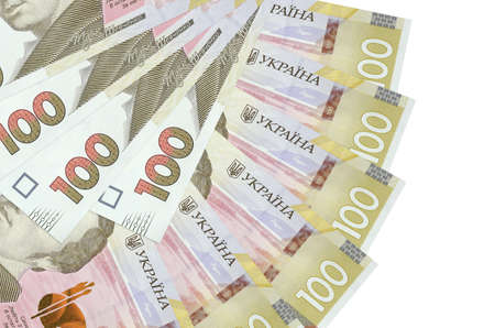 100 Ukrainian hryvnias bills lies isolated on white background with copy space stacked in fan shape...