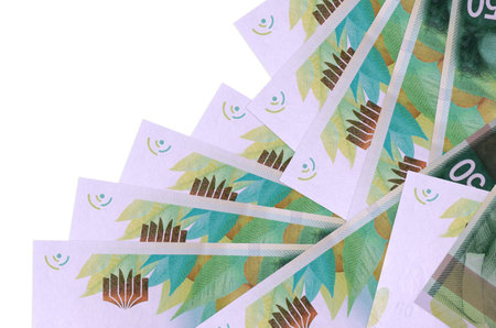 50 Israeli new shekels bills lies in different order isolated on white. Local banking or money...