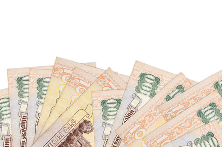 100 Ukrainian hryvnias bills lies on bottom side of screen isolated on white background with copy...