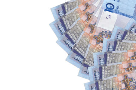10 Belorussian rubles bills lies isolated on white background with copy space. Rich life conceptual...