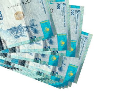 500 Kazakhstani tenge bills lies in small bunch or pack isolated on white. Mockup with copy space....
