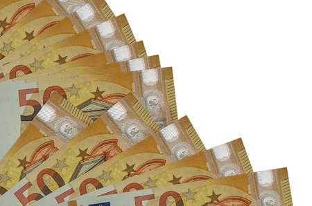50 euro bills lies isolated on white background with copy space stacked in fan close up. Payday time...