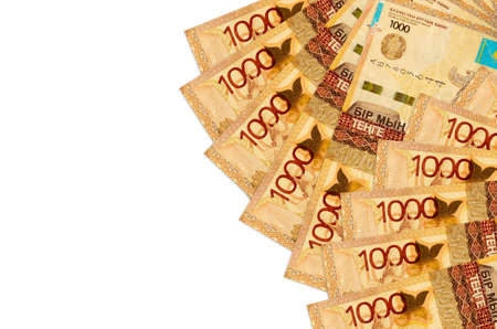 1000 Kazakhstani tenge bills lies isolated on white background with copy space. Rich life conceptual background. Big amount of national currency wealthの写真素材
