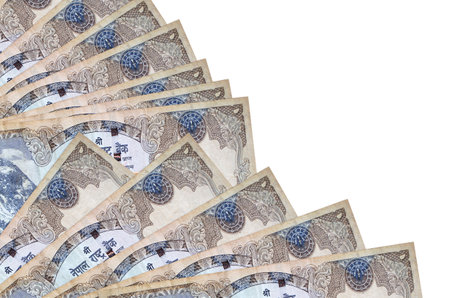 500 Nepalese rupees bills lies isolated on white background with copy space stacked in fan close up. Payday time concept or financial operationsの写真素材