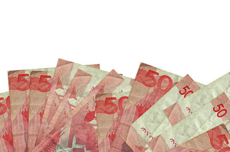 50 Philippine piso bills lies on bottom side of screen isolated on white background with copy space....