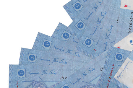 1 Malaysian ringgit bills lies in different order isolated on white. Local banking or money making...