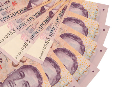 2 Singaporean dollars bills lies isolated on white background with copy space stacked in fan shape...