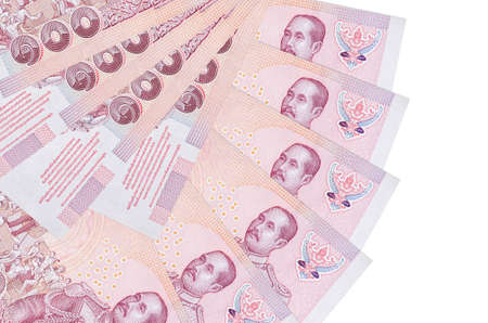 100 Thai Baht bills lies isolated on white background with copy space stacked in fan shape close up....