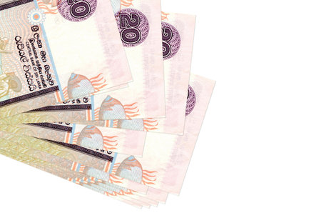 20 Sri Lankan rupees bills lies in small bunch or pack isolated on white. Mockup with copy space....