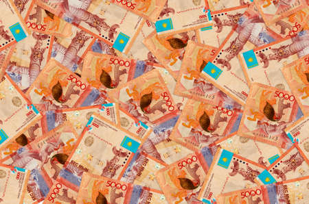 5000 Kazakhstani tenge bills lies in big pile. Rich life conceptual background. Big amount of money