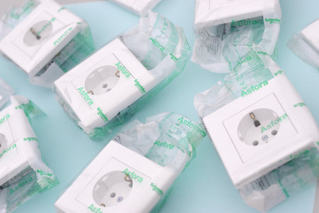 KHARKOV, UKRAINE - NOVEMBER 06, 2020: Schneider electric plastic electrical outlets with european plug standard. Schneider Electric is a European multinational company providing energyのeditorial素材