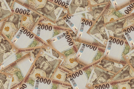 2000 Hungarian forint bills lies in big pile. Rich life conceptual background. Big amount of money