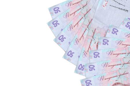 50 Ukrainian hryvnias bills lies isolated on white background with copy space. Rich life conceptual...