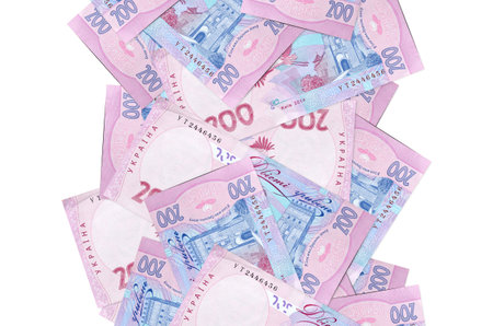 200 Ukrainian hryvnias bills flying down isolated on white. Many banknotes falling with white copy space on left and right sideの写真素材